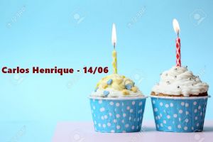 Delicious birthday cupcake on table on light blue background