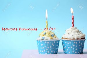 Delicious birthday cupcake on table on light blue background
